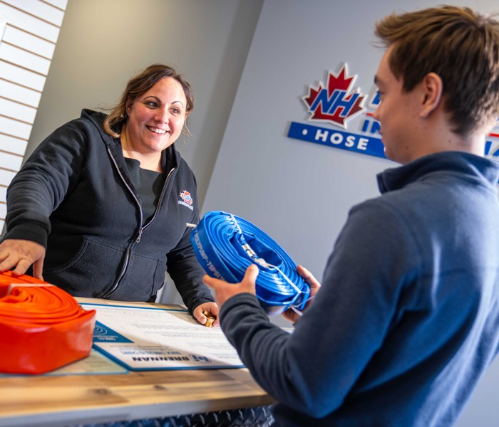 Neisha Bisson, CSR Manager Inside at National Hose & Equipment Ltd, serving customers